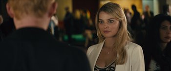 Movie still from “About Time” (2013), directed by Richard Curtis – A beautiful woman standing next to a man in a suit; Close Up shot, Over the shoulder angle