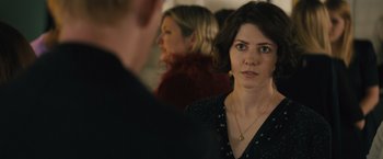 Movie still from “About Time” (2013), directed by Richard Curtis – A woman standing next to another woman in a room; Close Up shot, Over the shoulder angle