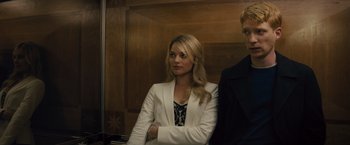 Movie still from “About Time” (2013), directed by Richard Curtis – A woman standing next to a man in an elevator; Medium shot, Over the shoulder angle