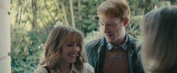 Movie still from “About Time” (2013), directed by Richard Curtis – A man and a woman standing next to each other; Close Up shot, Over the shoulder angle