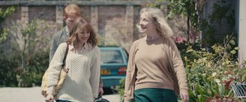 Movie still from “About Time” (2013), directed by Richard Curtis – Two women and a man walking down a street; Medium shot, Over the shoulder angle