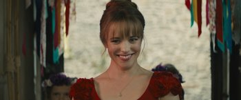 Movie still from “About Time” (2013), directed by Richard Curtis – A person wearing a red dress; Close Up shot, Over the shoulder angle