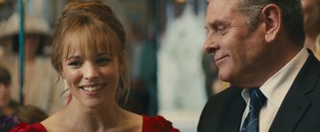 Movie still from “About Time” (2013), directed by Richard Curtis – A man and a woman smiling for the camera; Close Up shot, Over the shoulder angle