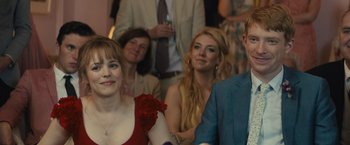 Movie still from “About Time” (2013), directed by Richard Curtis – A woman in a red dress and a man in a blue suit; Close Up shot, Over the shoulder angle