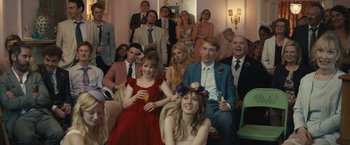 Movie still from “About Time” (2013), directed by Richard Curtis – A group of people sitting and standing in a room; Wide shot, High angle