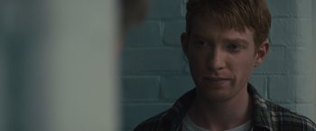 Movie still from “About Time” (2013), directed by Richard Curtis – A man with red hair is looking into a mirror; Close Up shot, Over the shoulder angle