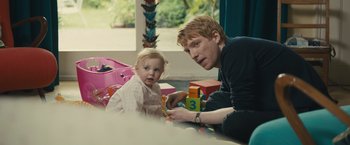 Movie still from “About Time” (2013), directed by Richard Curtis – A man and a little girl are playing with blocks; Medium shot, Over the shoulder angle