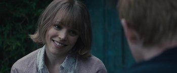 Movie still from “About Time” (2013), directed by Richard Curtis – A person smiling; Close Up shot, Over the shoulder angle