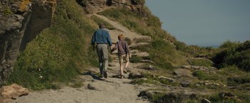 Movie still from “About Time” (2013), directed by Richard Curtis – A man and a boy are walking up a hill; Wide shot, High angle