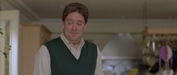 Movie still from “About a Boy” (2002), directed by Chris Weitz – A person wearing a vest; Close Up shot, Over the shoulder angle