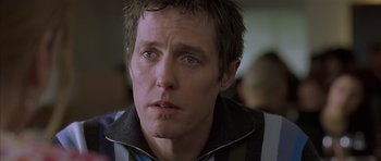Movie still from “About a Boy” (2002), directed by Chris Weitz – A person looking at the camera; Close Up shot, Over the shoulder angle