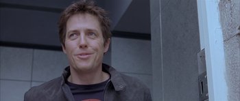 Movie still from “About a Boy” (2002), directed by Chris Weitz – A person wearing a black shirt; Close Up shot, Low angle