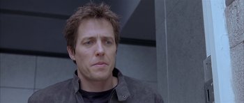 Movie still from “About a Boy” (2002), directed by Chris Weitz – A person wearing a black shirt; Close Up shot, Low angle