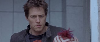 Movie still from “About a Boy” (2002), directed by Chris Weitz – A person wearing a jacket; Close Up shot, Over the shoulder angle