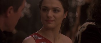 Movie still from “About a Boy” (2002), directed by Chris Weitz – A person wearing a red dress; Close Up shot, Over the shoulder angle