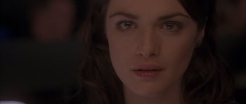 Movie still from “About a Boy” (2002), directed by Chris Weitz – A woman's face in the dark; Close Up shot, Over the shoulder angle