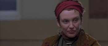 Movie still from “About a Boy” (2002), directed by Chris Weitz – A person wearing a head scarf; Close Up shot, Over the shoulder angle