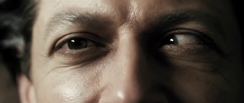 Movie still from “Adam Resurrected” (2008), directed by Paul Schrader – View of a person's eyes; Extreme Close Up shot, Overhead angle