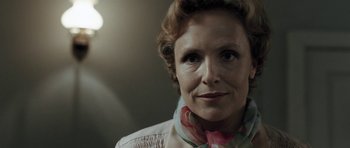 Movie still from “Adam Resurrected” (2008), directed by Paul Schrader – A person wearing a neck scarf; Close Up shot, Low angle