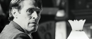 Movie still from “Adam Resurrected” (2008), directed by Paul Schrader – Black and white photograph of a man looking at the camera; Close Up shot, Low angle