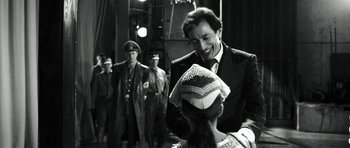 Movie still from “Adam Resurrected” (2008), directed by Paul Schrader – A black and white photo of a man and a woman; Medium shot, Over the shoulder angle