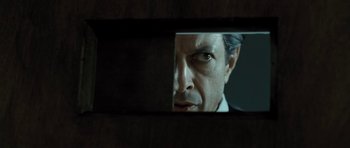 Movie still from “Adam Resurrected” (2008), directed by Paul Schrader – A man looking at himself in a mirror; Close Up shot, Low angle
