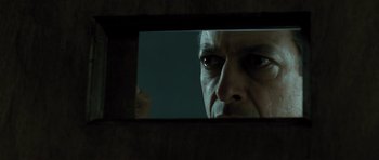Movie still from “Adam Resurrected” (2008), directed by Paul Schrader – A man looking at himself in a mirror; Close Up shot, Low angle