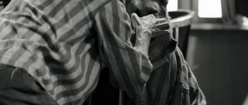 Movie still from “Adam Resurrected” (2008), directed by Paul Schrader – A man holding his face in his hands; Close Up shot, High angle