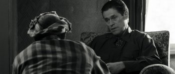 Movie still from “Adam Resurrected” (2008), directed by Paul Schrader – An older man sitting in front of a mirror; Close Up shot, Over the shoulder angle