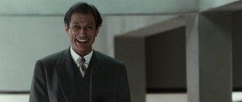 Movie still from “Adam Resurrected” (2008), directed by Paul Schrader – A man in a suit and tie smiling for the camera; Close Up shot, Low angle