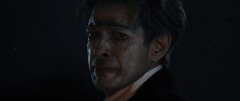 Movie still from “Adam Resurrected” (2008), directed by Paul Schrader – A person wearing a suit and tie; Close Up shot, Over the shoulder angle