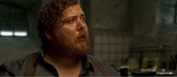 Movie still from “Adam's Apples” (2005), directed by Anders Thomas Jensen – A person with a beard; Close Up shot, Low angle