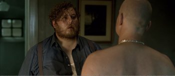 Movie still from “Adam's Apples” (2005), directed by Anders Thomas Jensen – A man looking at himself in the mirror; Close Up shot, Over the shoulder angle