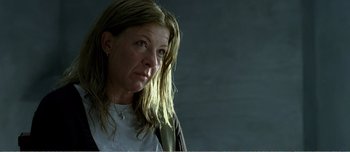 Movie still from “Adam's Apples” (2005), directed by Anders Thomas Jensen – A person with long blonde hair; Close Up shot, Low angle