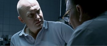 Movie still from “Adam's Apples” (2005), directed by Anders Thomas Jensen – A man and a woman are looking at one another in the mirror; Close Up shot, Over the shoulder angle