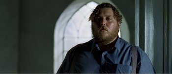 Movie still from “Adam's Apples” (2005), directed by Anders Thomas Jensen – A person with a beard; Close Up shot, Low angle