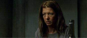 Movie still from “Adam's Apples” (2005), directed by Anders Thomas Jensen – A person with long brown hair; Close Up shot, Over the shoulder angle