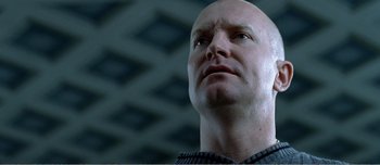 Movie still from “Adam's Apples” (2005), directed by Anders Thomas Jensen – A bald man looking up into the sky; Close Up shot, Low angle