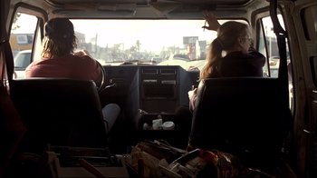 Movie still from “Adaptation.” (2002), directed by Spike Jonze – Two people sitting in the back of a van; Medium shot, Low angle