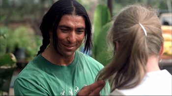 Movie still from “Adaptation.” (2002), directed by Spike Jonze – A man with long hair talking to a woman; Close Up shot, Over the shoulder angle
