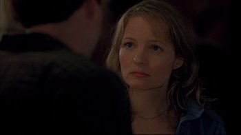 Movie still from “Adaptation.” (2002), directed by Spike Jonze – A person sitting in front of another person; Close Up shot, Over the shoulder angle