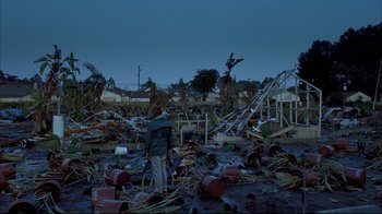 Movie still from “Adaptation.” (2002), directed by Spike Jonze – A man standing in the middle of a destroyed area; Wide shot, High angle