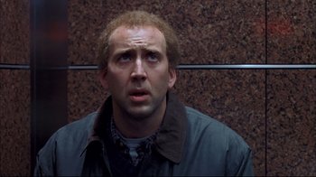 Movie still from “Adaptation.” (2002), directed by Spike Jonze – A person wearing a jacket; Close Up shot, Low angle