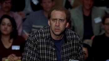 Movie still from “Adaptation.” (2002), directed by Spike Jonze – A person wearing a plaid shirt; Close Up shot, Low angle