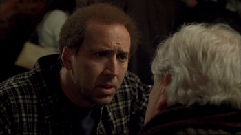 Movie still from “Adaptation.” (2002), directed by Spike Jonze – A person talking to another person; Close Up shot, Over the shoulder angle