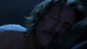 Movie still from “Adaptation.” (2002), directed by Spike Jonze – A person sleeping on a bed; Close Up shot, High angle