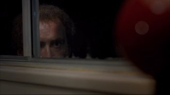 Movie still from “Adaptation.” (2002), directed by Spike Jonze – A man looking at himself in a mirror; Extreme Close Up shot, Low angle