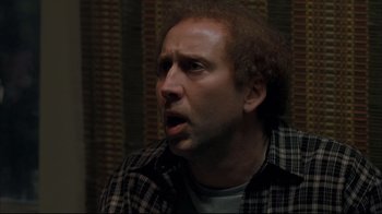 Movie still from “Adaptation.” (2002), directed by Spike Jonze – A person wearing a plaid shirt; Close Up shot, Over the shoulder angle