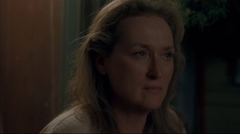 Movie still from “Adaptation.” (2002), directed by Spike Jonze – A person with long blonde hair; Close Up shot, Over the shoulder angle