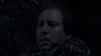 Movie still from “Adaptation.” (2002), directed by Spike Jonze – A person with his eyes closed; Close Up shot, Low angle